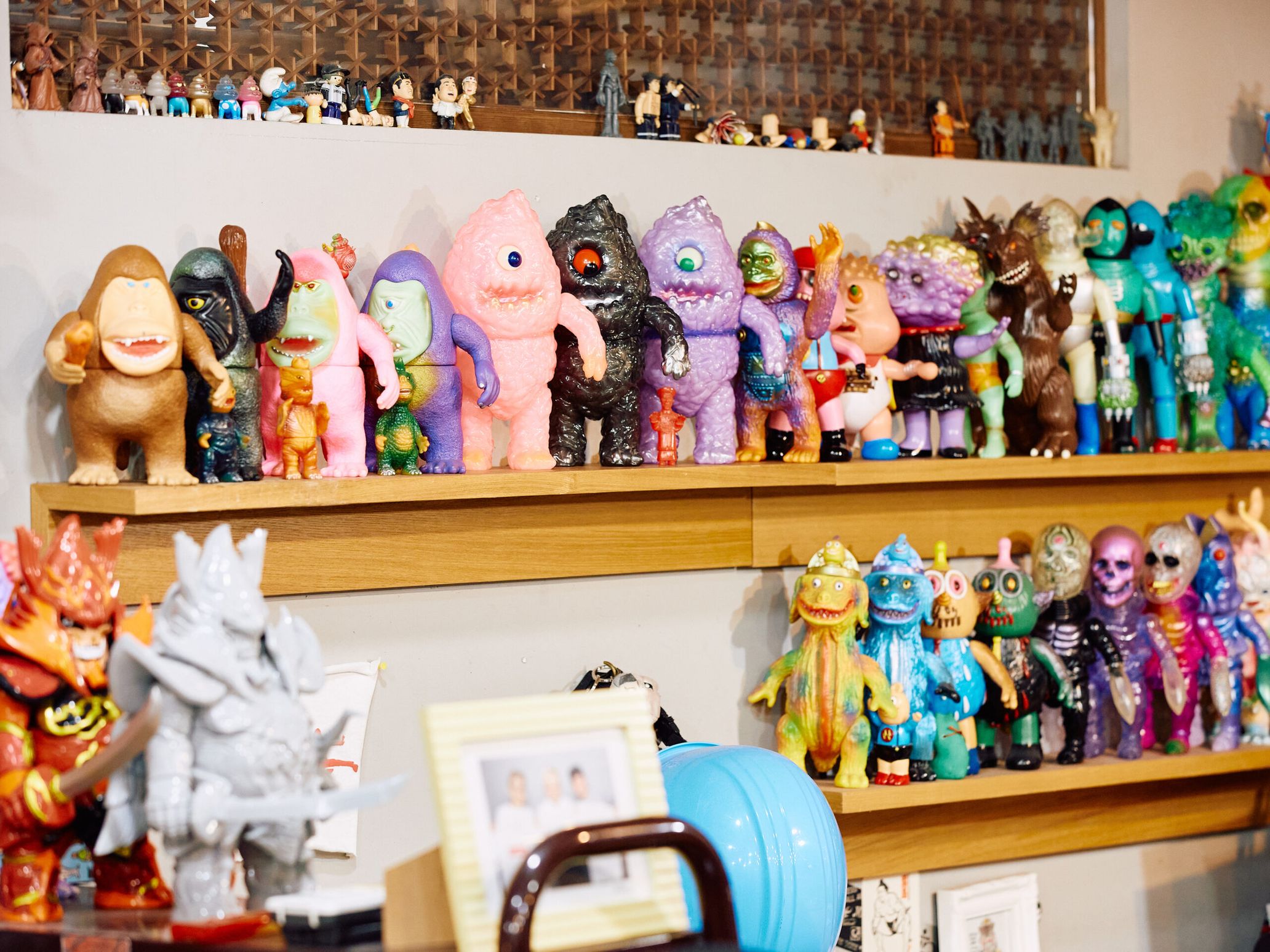 At Oyakata’s office, a massive collection of sofubi toys is lined up on the shelves